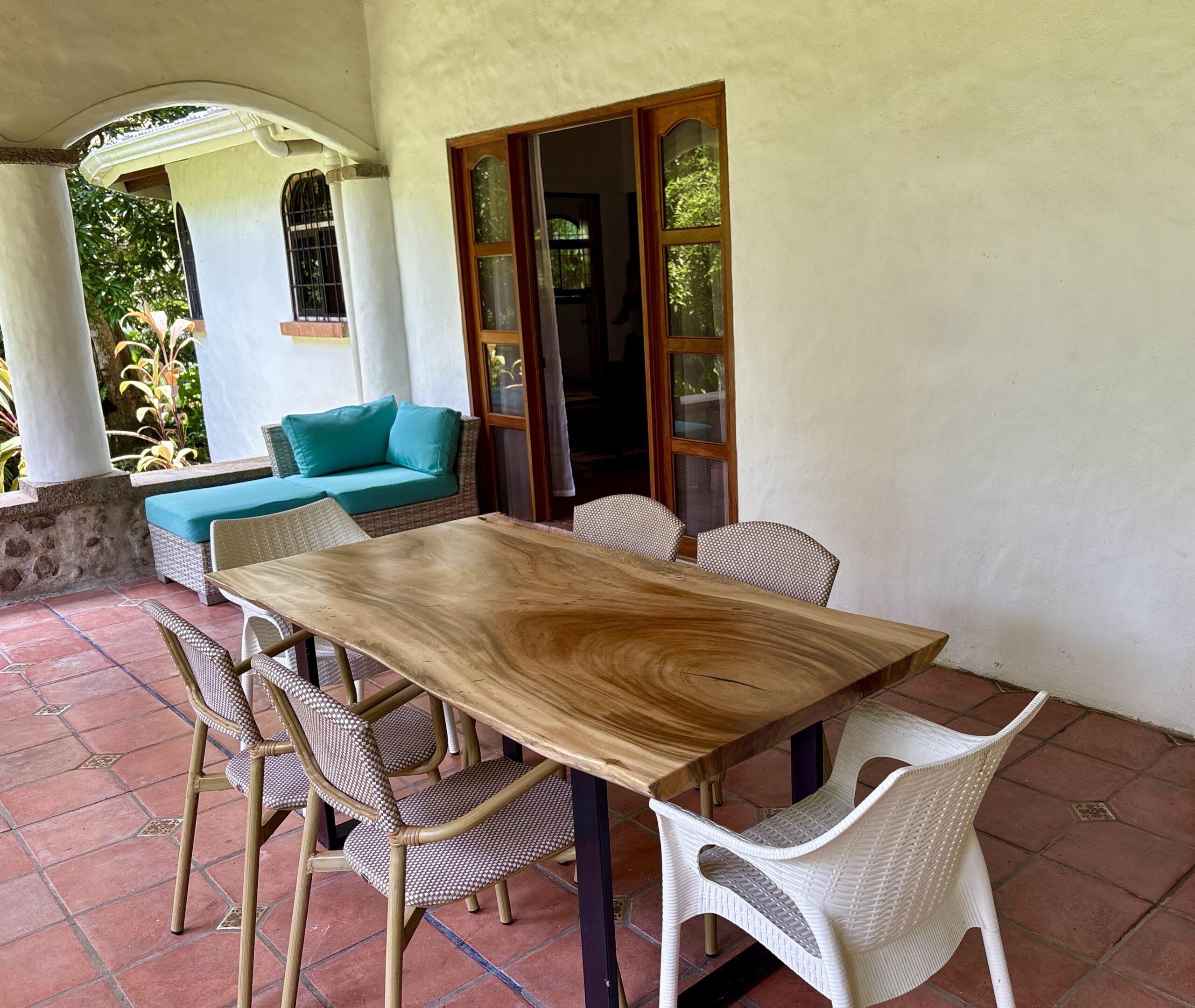 Outdoor terrace of villa with rainforest surroundings