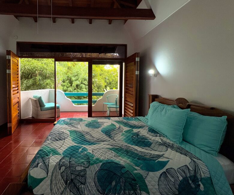 Standard room at Planeta Sano Hotel with cozy bedding and natural lighting