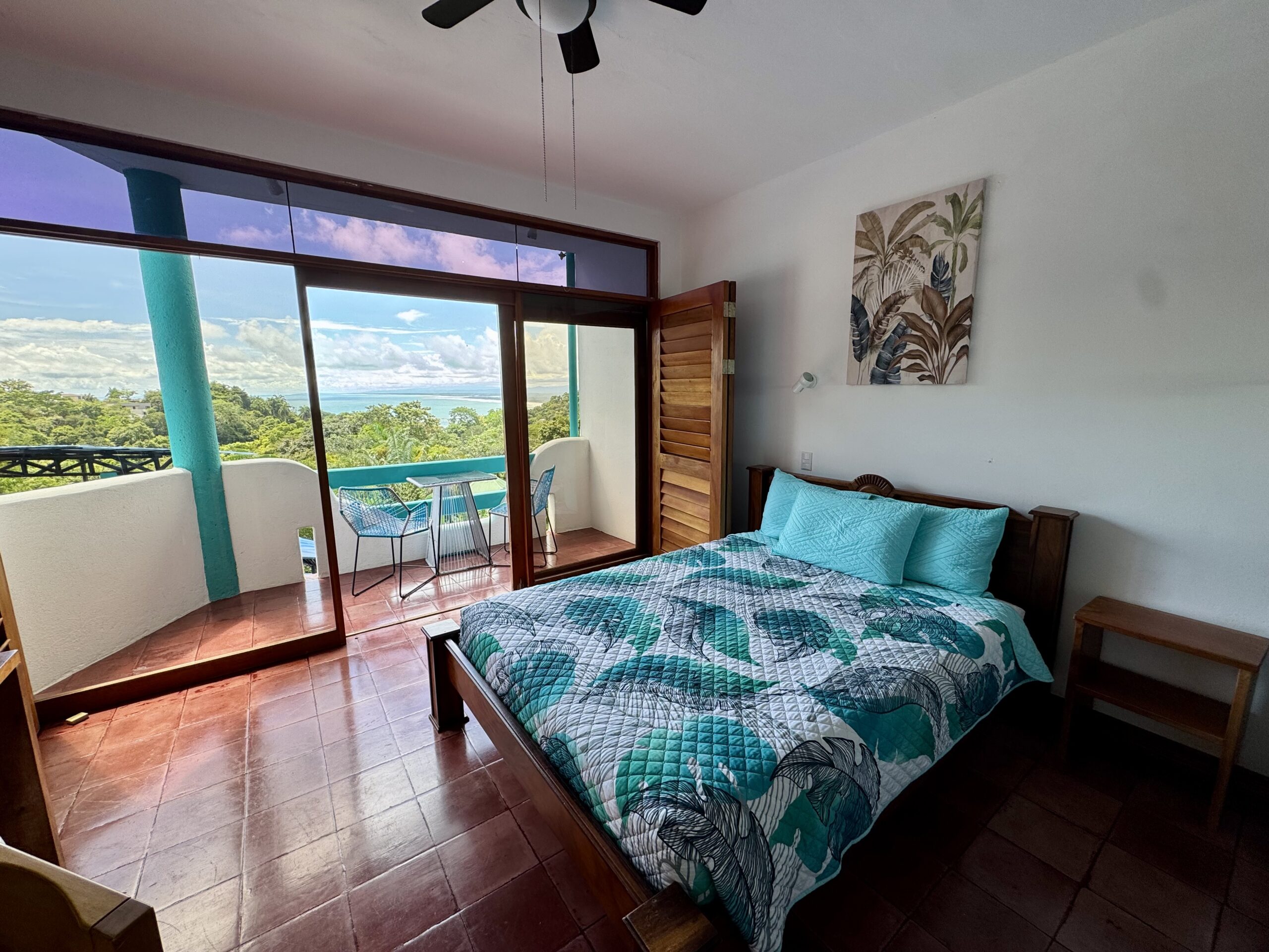 Superior room at Planeta Sano Hotel with partial ocean view and warm decor