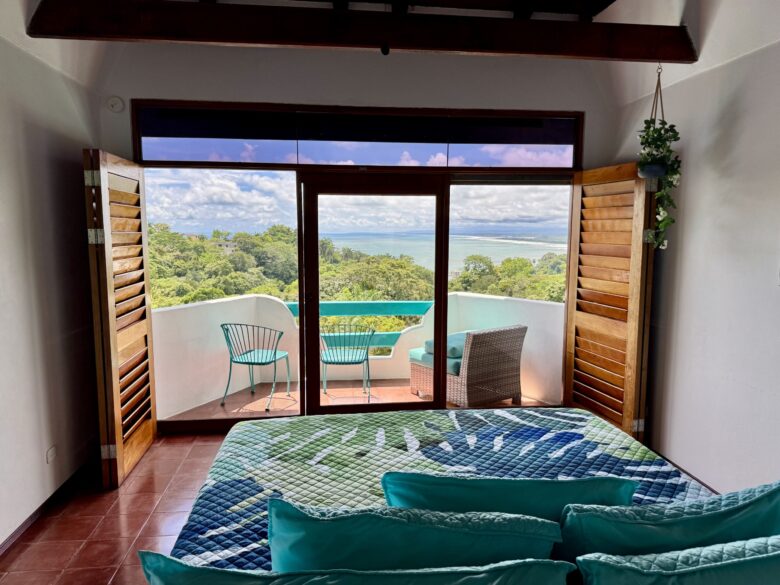 Luxury ocean-view room with modern amenities at Hotel Planeta Sano in Manuel Antonio.